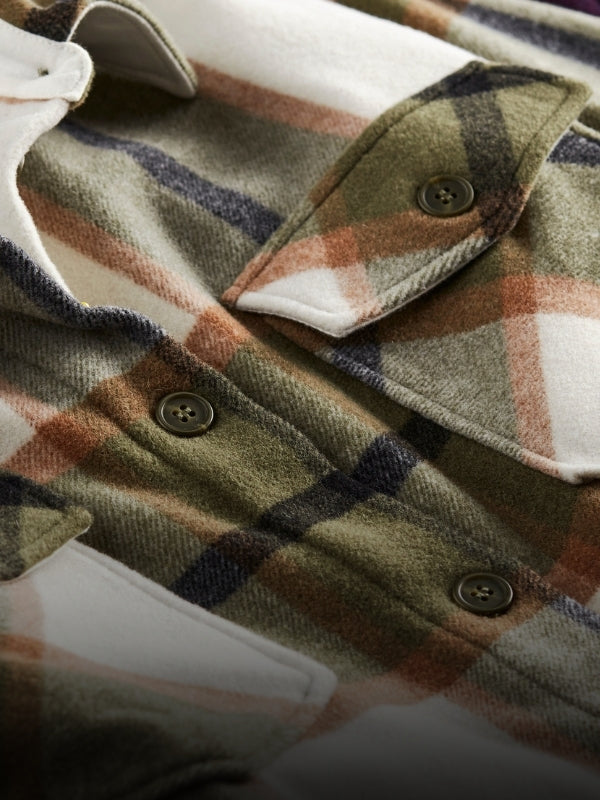 Zoomed image of a Sawyer shacket in forest plaid showing texture and detail mobile size