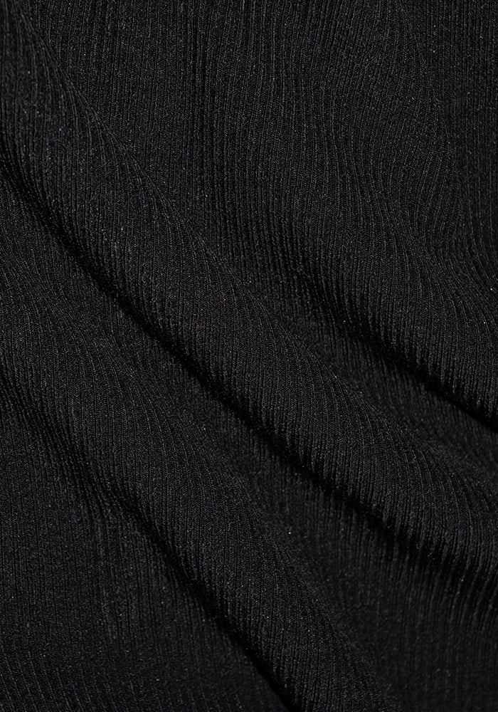 Close-up of black fabric with a vertical ribbed texture, crafted from Australian Merino Wool. The material is soft and slightly shiny, similar to the elegant design of the Woolx Sloane Ribbed Tank - Black, creating a subtle play of light and shadows across the folds.