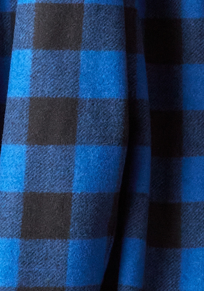 Close-up of an ultra-heavyweight fabric displaying the Burlington Jacket - Bright Blue Black pattern by Woolx, evoking the luxurious texture of fine Merino wool jackets.