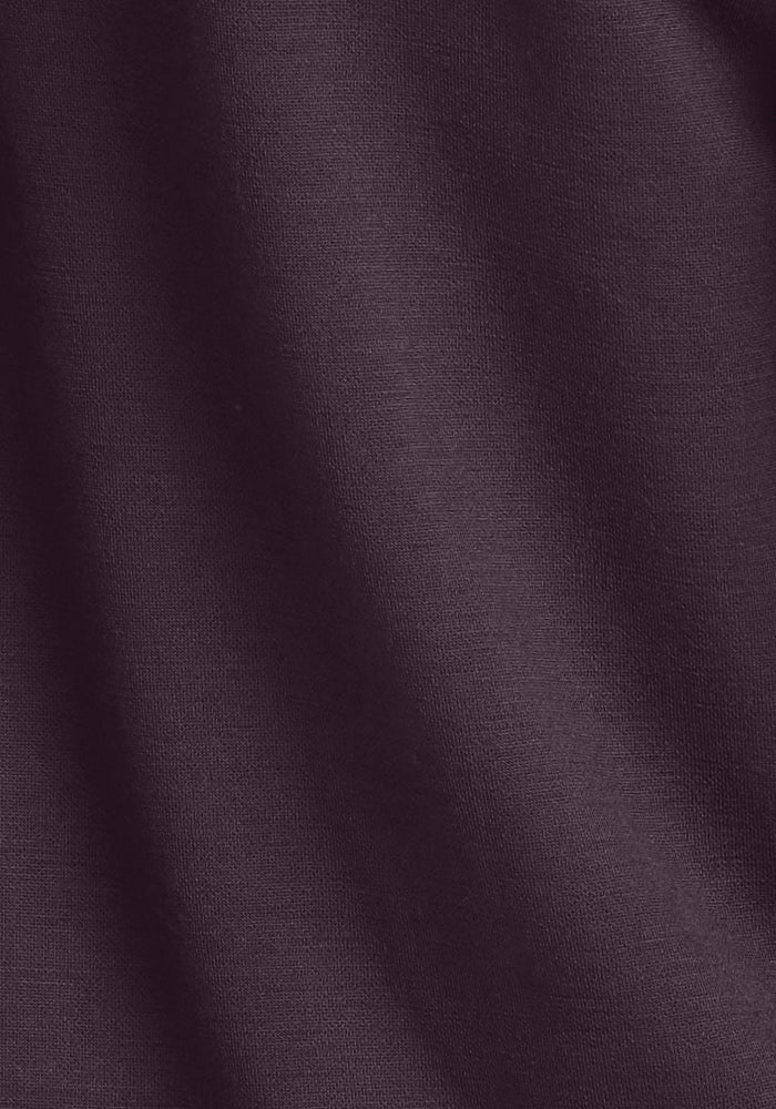 Close-up of dark brown Wool Aire™ Mason - Chocolate Plum fabric from Woolx, showcasing a soft, smooth texture with gentle, subtle folds. The lightweight material is uniformly colored and crafted from premium Australian Merino wool.