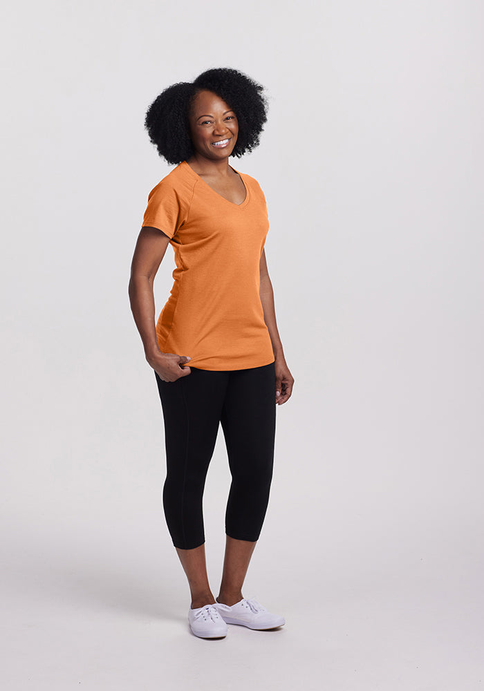 Model wearing Mia v neck - Coral Gold