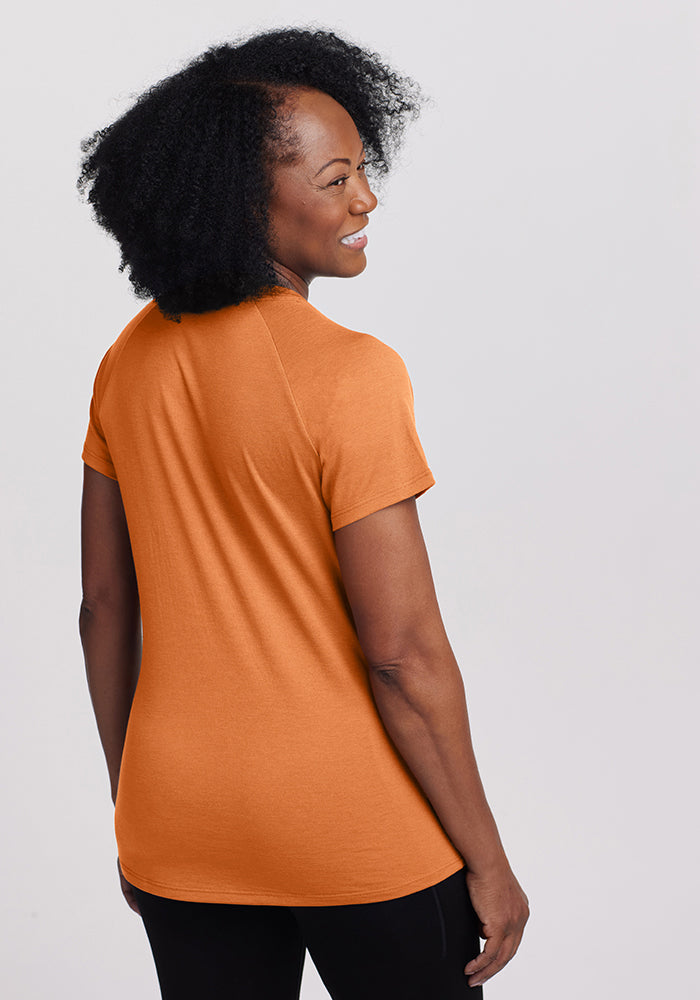 Model wearing Mia v neck - Coral Gold