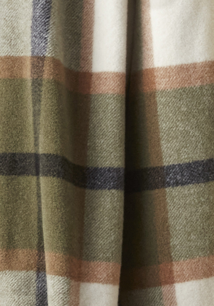 Close-up of a woolen fabric with a plaid pattern consisting of intersecting stripes in earth tones of green, brown, and beige. The soft and warm texture suggests it could make for a cozy winter jacket or the Woolx Sutton Shacket - Forest Plaid, perfect for those chilly days.