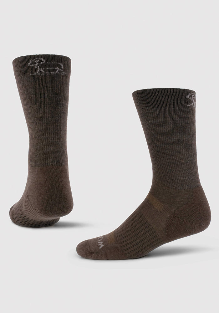 A pair of the Harbor Crew Sock Light Cushion - French Roast by Woolx is displayed against a plain background. One sock showcases a horse silhouette near the top. The fabric appears textured with subtle ribbing patterns and offers an odor-resistant experience, making it ideal for your next hiking adventure.