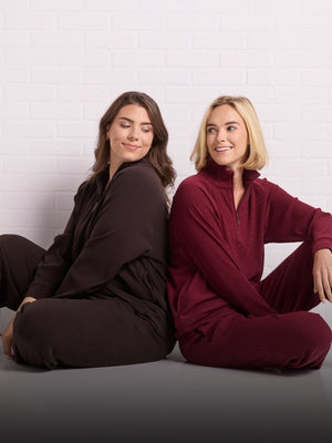 Models wearing Quinn and Luca ribbed sets in french roast and cranberry melange