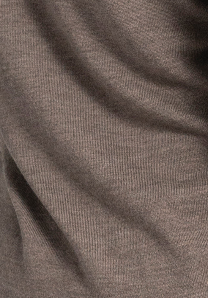 Close-up of the Francesca Sweater in Sable from Woolx, showcasing its finely knit textured fabric and subtle folds.