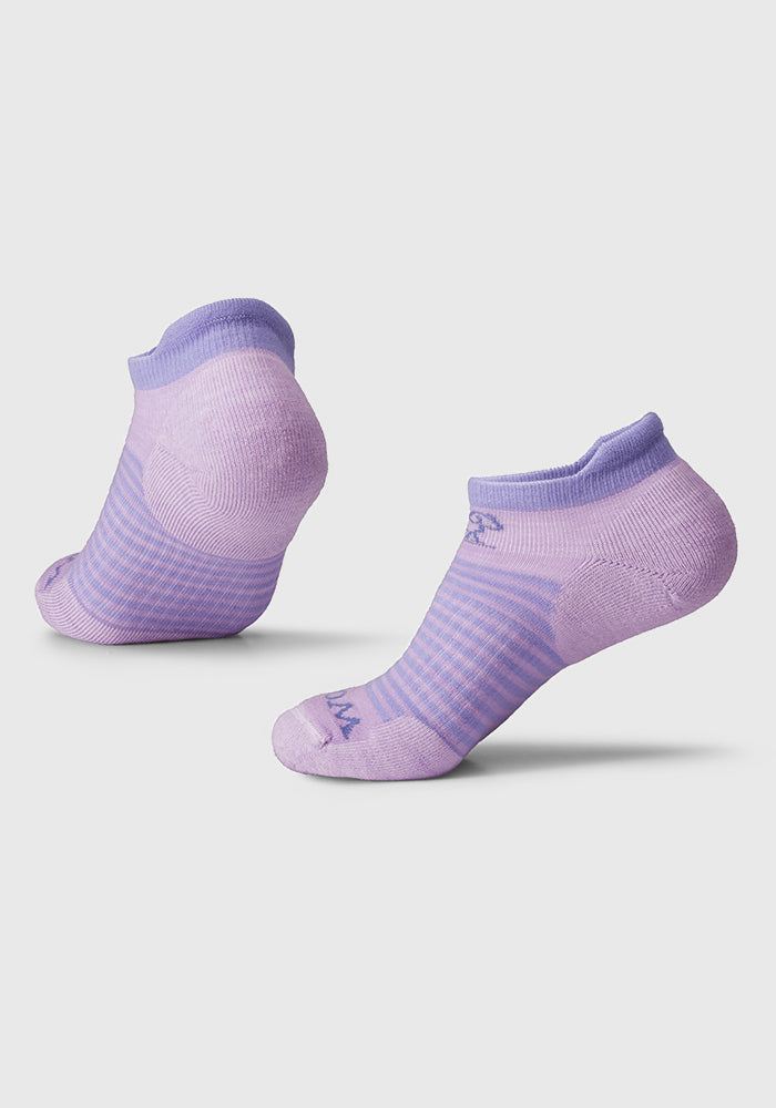 The Woolx Amelia No Show Tab Lightweight Socks in Lavender Sky, featuring darker purple accents and subtle stripe patterns, are designed with antimicrobial properties and displayed against a plain white background.