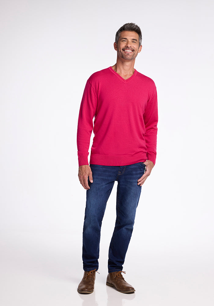 A man in a Woolx Vincenzo Sweater - Berry Burst.