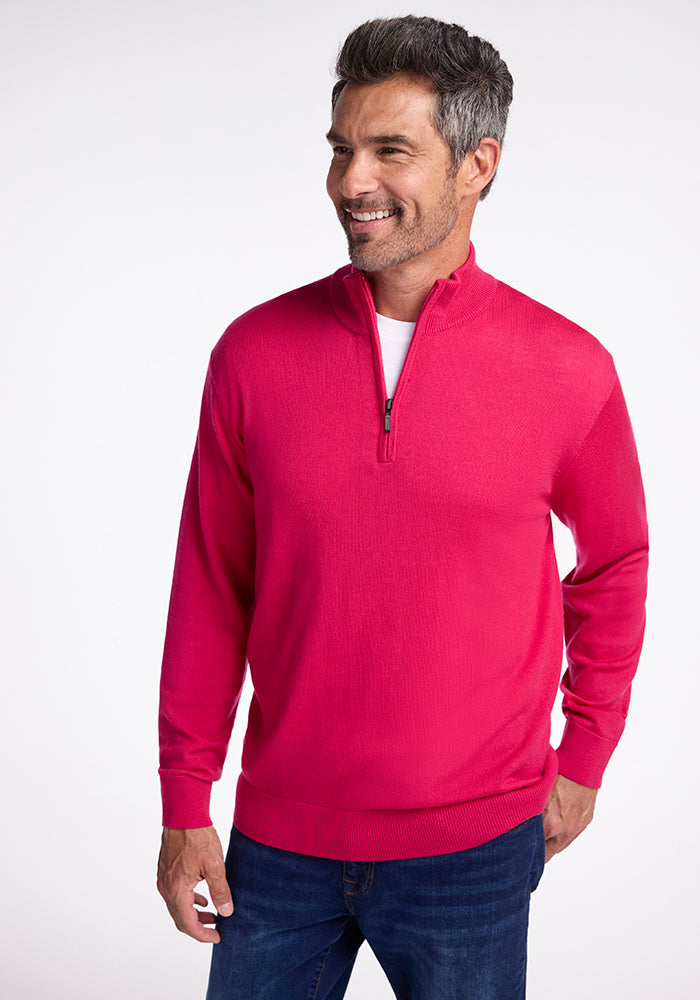 A man in the Enzo Quarter Zip - Berry Burst by Woolx. 