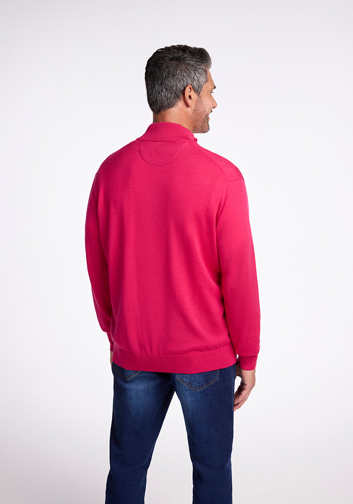 A man in an Enzo Quarter Zip by Woolx in Berry Burst.