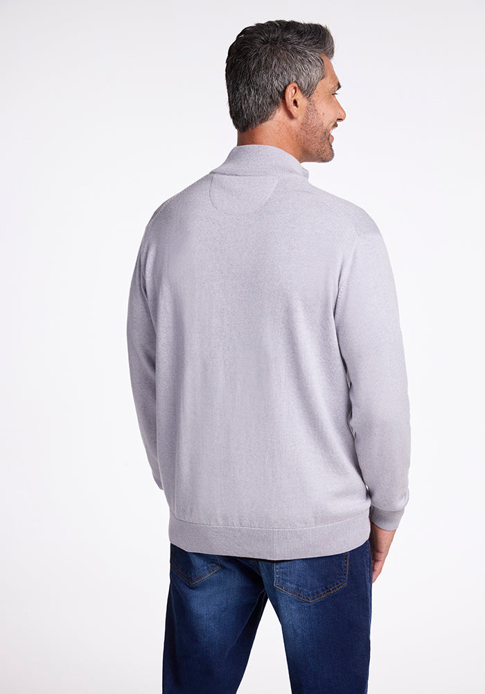 A man in an Enzo Quarter Zip - Mist from Woolx.