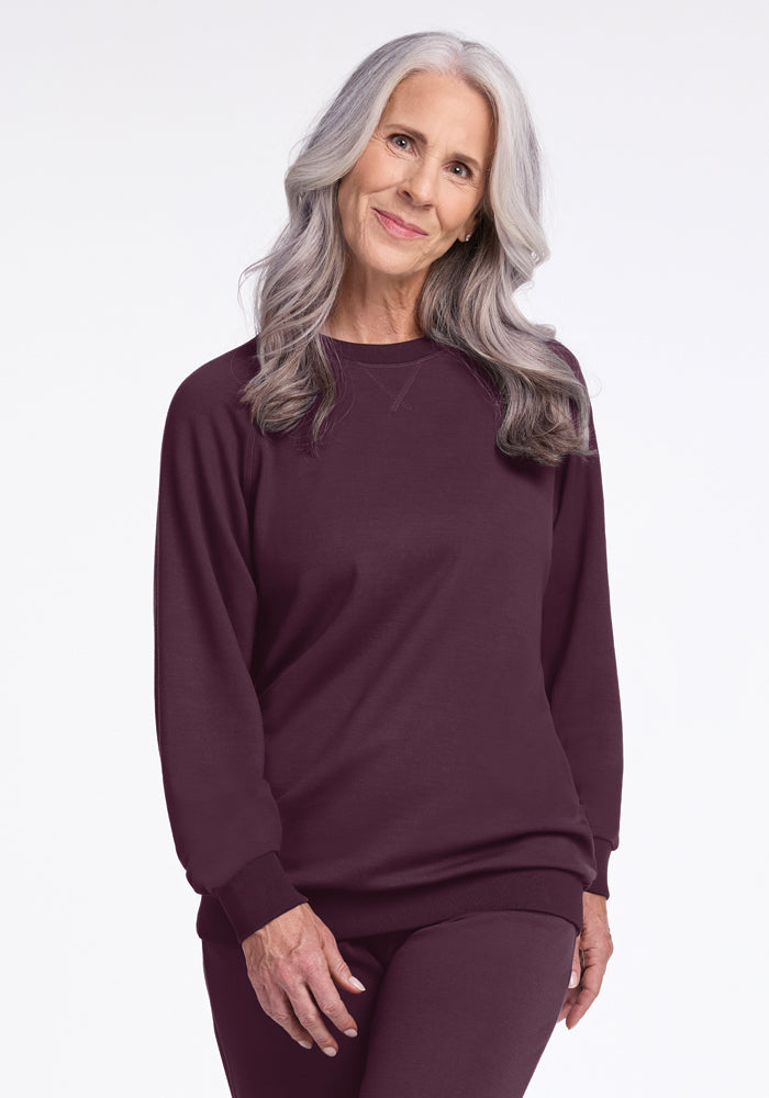 Model wearing bailey crewneck sweatshirt in wine tasting color 