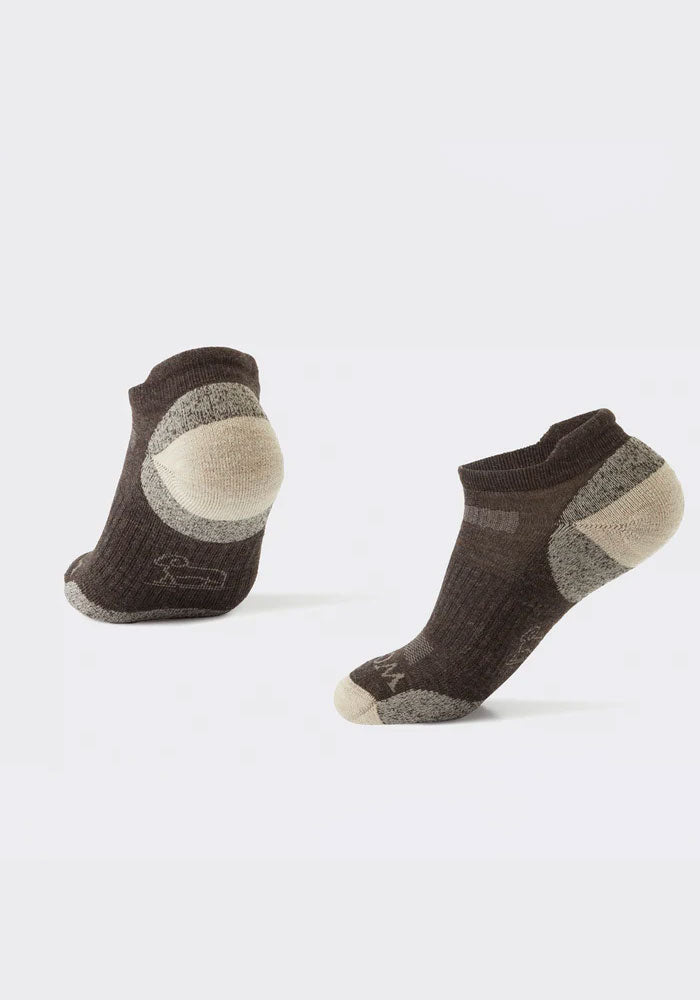 The Tempo Ankle Socks Full Cushion by Woolx are displayed, showcasing their design in a dark taupe color with reinforced heel and toe sections. Crafted from thick, textured Merino wool, these socks are ideal for outdoor activities, providing both comfort and durability. The hiking socks stand upright against a plain, light background.