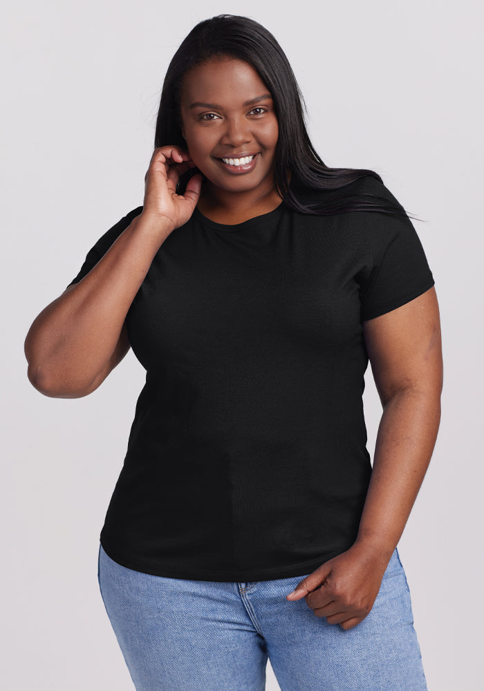 A woman in a moisture-wicking Woolx Liza Crew Neck Tee - Black. 